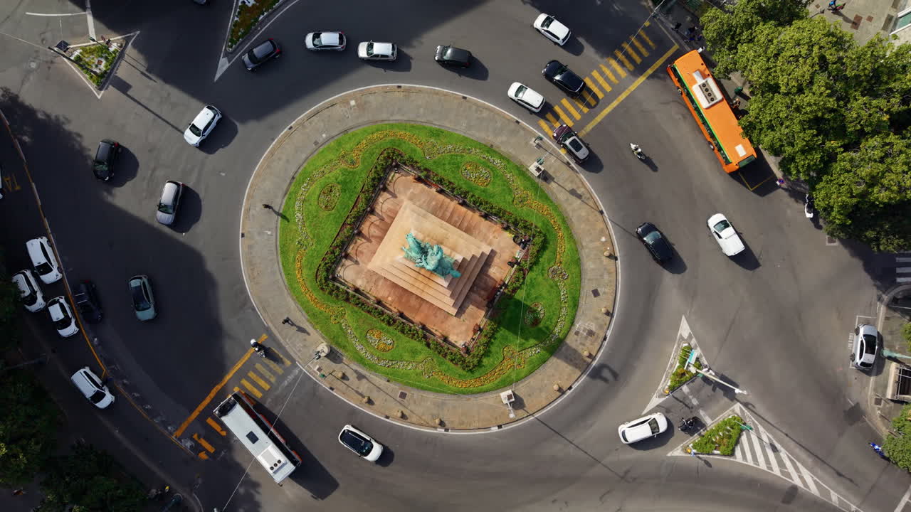 Aerial view of Genoa roundabout with cars, lively urban travel vibe