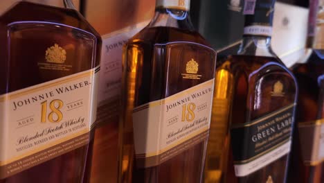 close-up view of johnnie walker 18 year old scotch whisky bottles