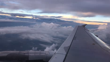 aerial view of clouds after taking off from airport through an airliner window