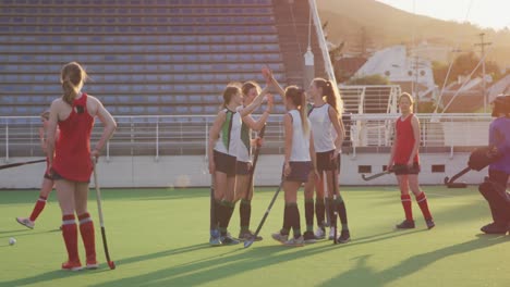 Female-hockey-players-playing-on-the-field