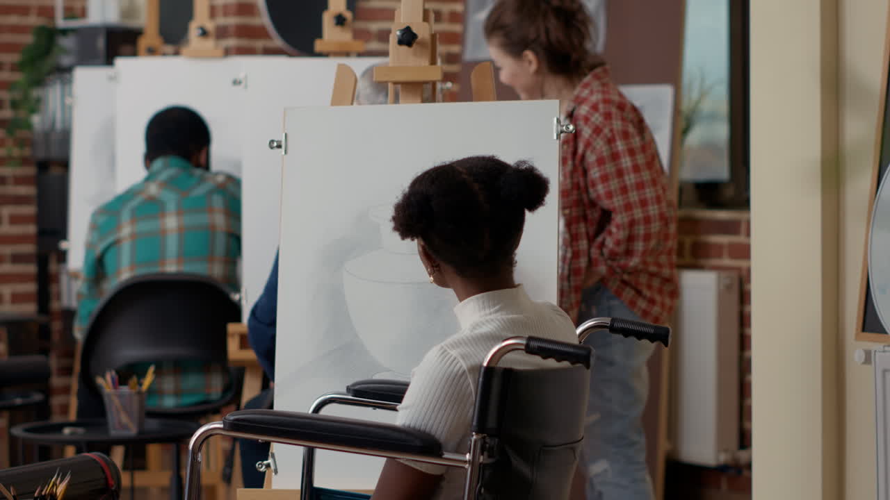 African american woman with disability attending art class program