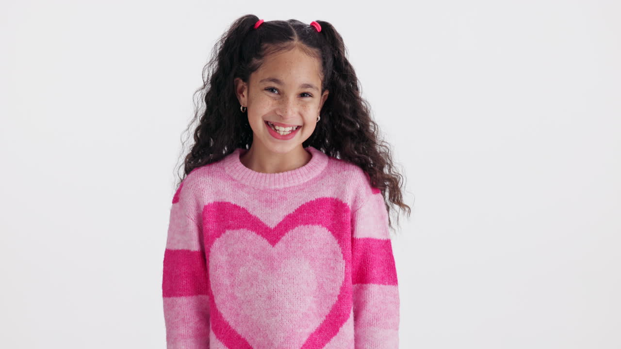 Girl in pink heart sweater