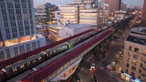 aerial view of the 1 train in harlem. shot on a winter evening in new york city