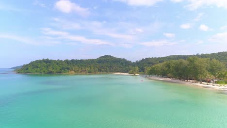 aerial view of a tropical beach with crystal clear water