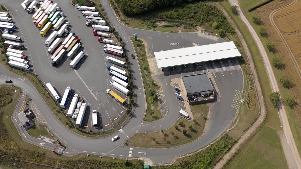 Top down aerial drone view of petrol station and truck stop service area in Rugby England UK