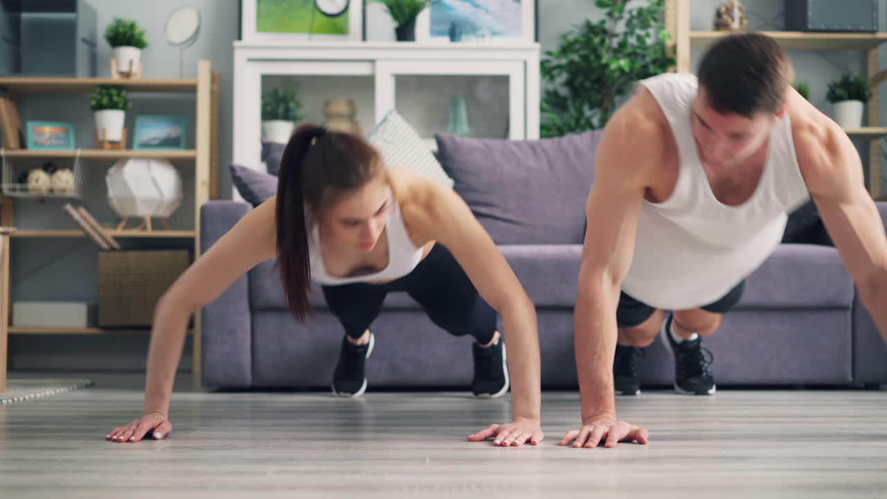 Couple Doing Push-ups at Home