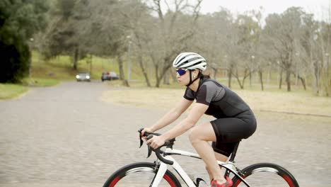 sporty woman riding bicycle