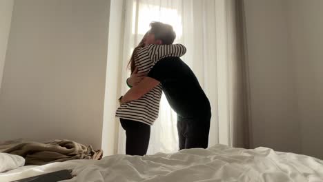 Couple Hugging by the Window