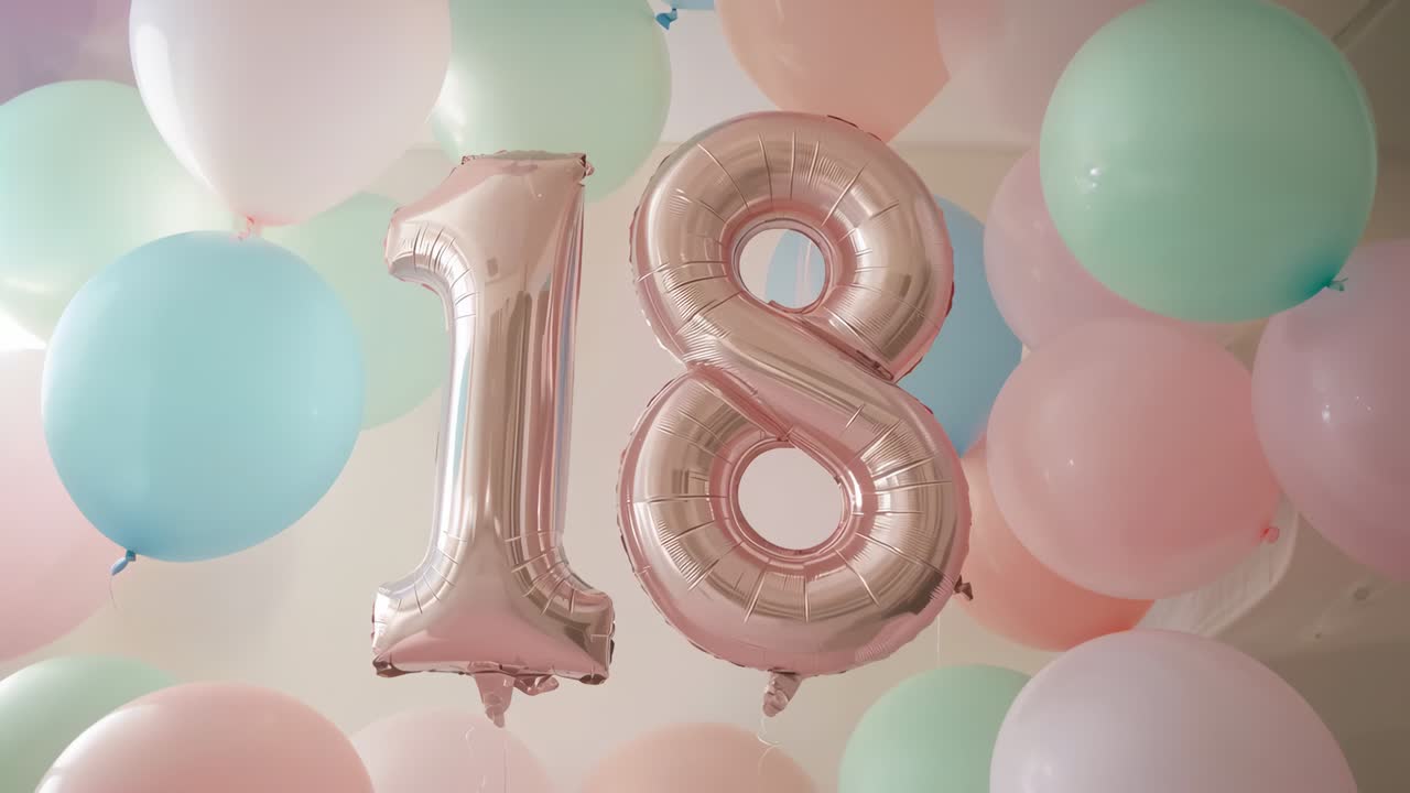 Drifting rose-gold foil balloons forming 18 swaying in room from helium lift, showing lens glare