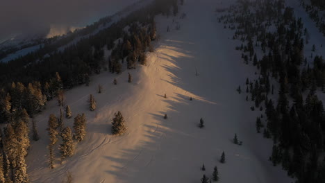 winter sunrise above snow capped mountain hills
