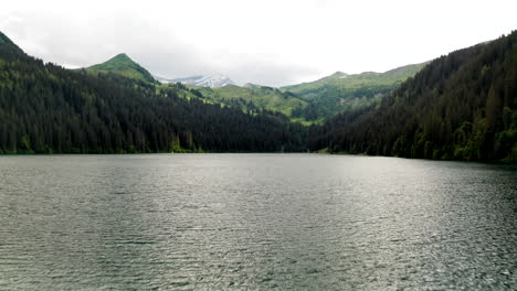 flying low over swiss mountain lake