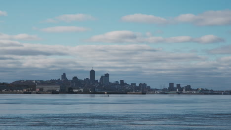 Quebec-City's-skyline-with-blue-sky-and-clouds,-the-majestic-St