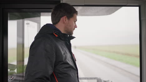 a young man on a shuttle bus after visiting mont-saint-michel, france