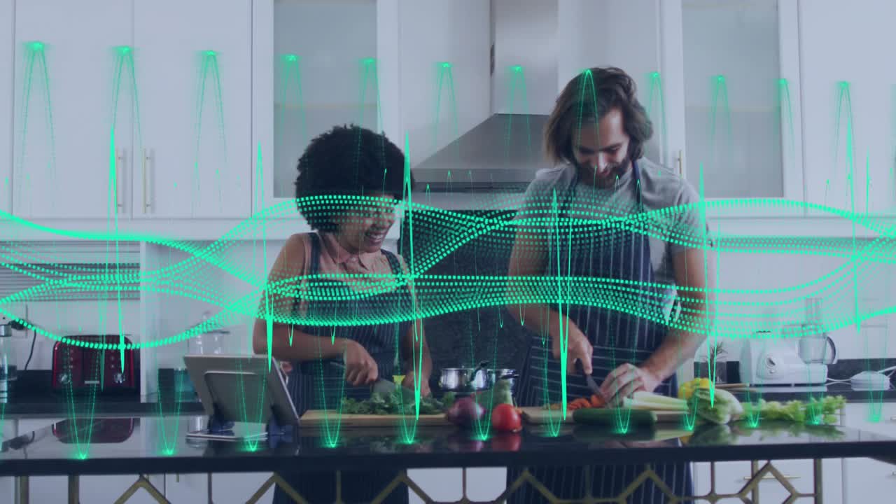 Couple chopping vegetables cooking meal and sharing glance and laughter as green waveform pulsing
