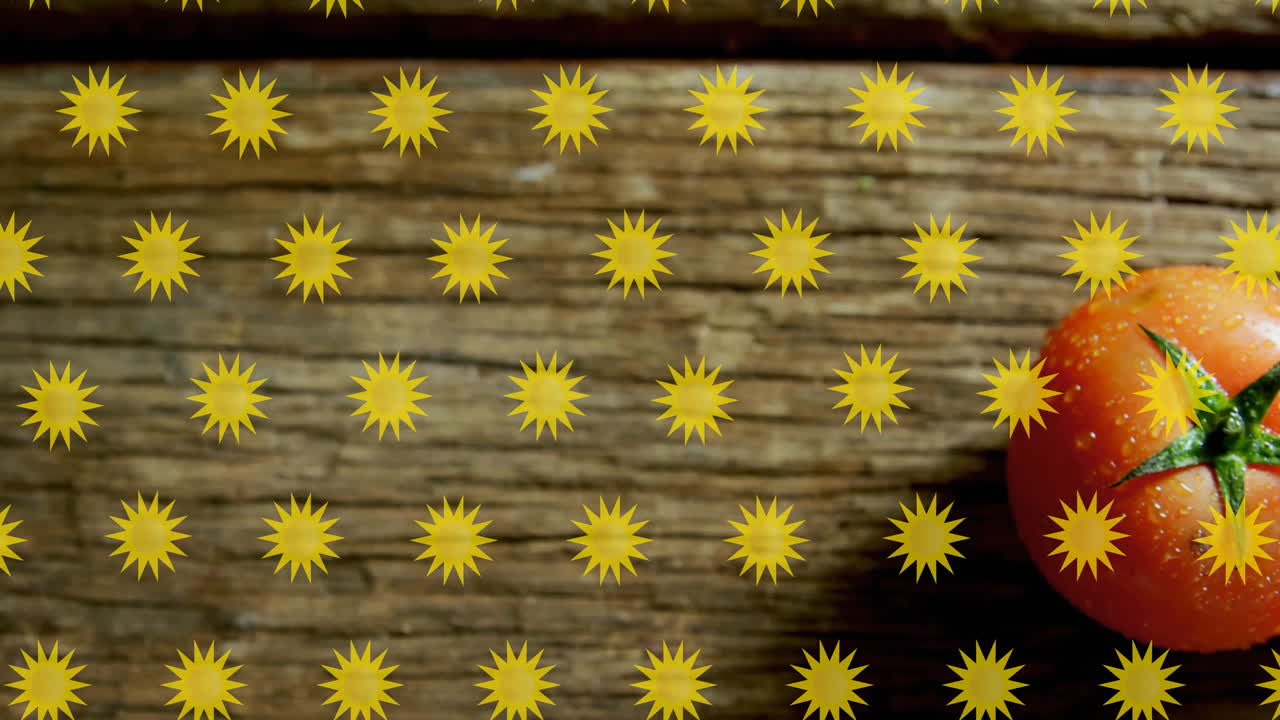 Yellow star shapes animation over wooden surface with tomato on right