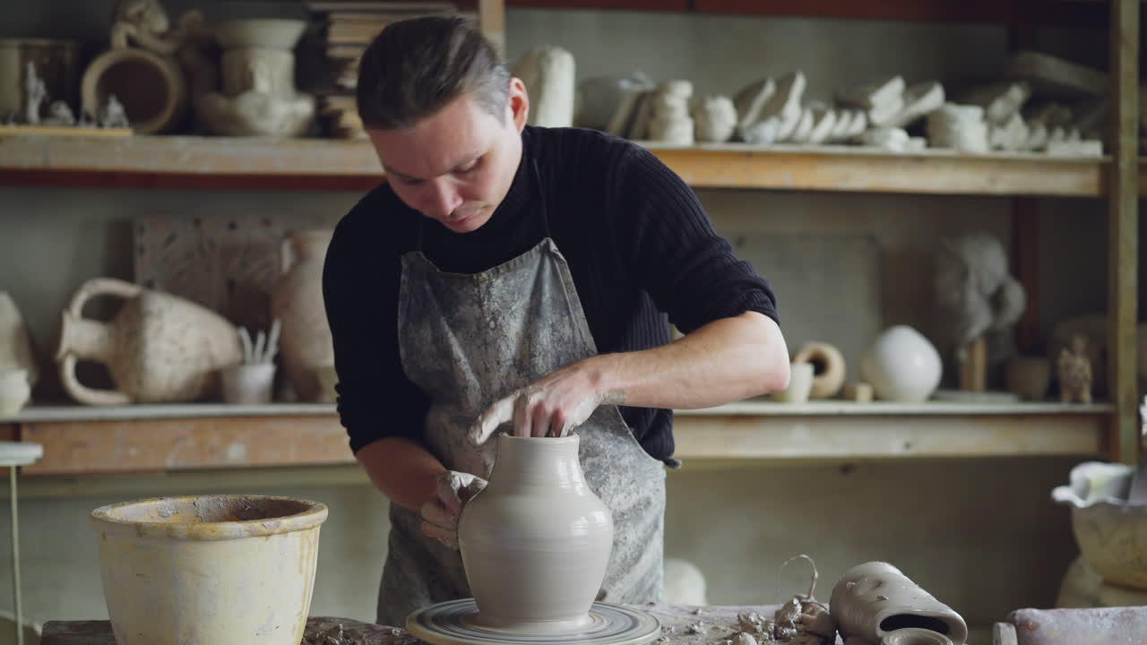 Artisan Shaping Clay Pot