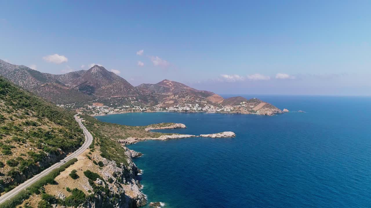 A shot from a drone of a road on the coast of the Greek island of Crete