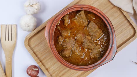 pork curry in a clay pot