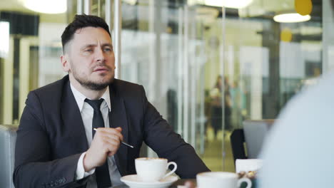 Business Meeting in a Modern Cafe