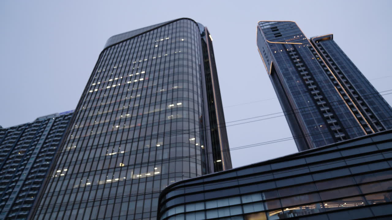 High Raised Buildings and Modern Architecture in Central City Financial Business District during Blue Hour, Cinematic Slow Motion Dolly Shot, Perspective Matters