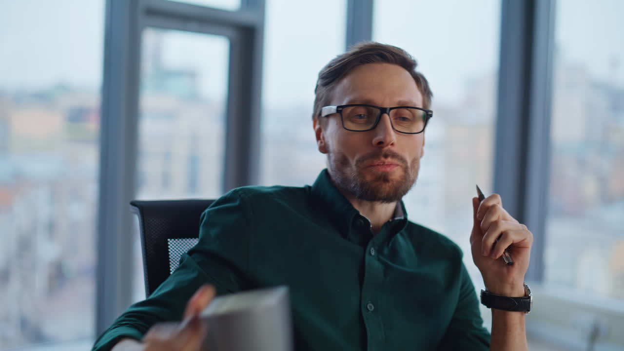 Creative businessman pondering ideas at office panoramic window closeup smiling