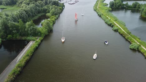 aerial view of pleasure boats sailing in and out of harbor