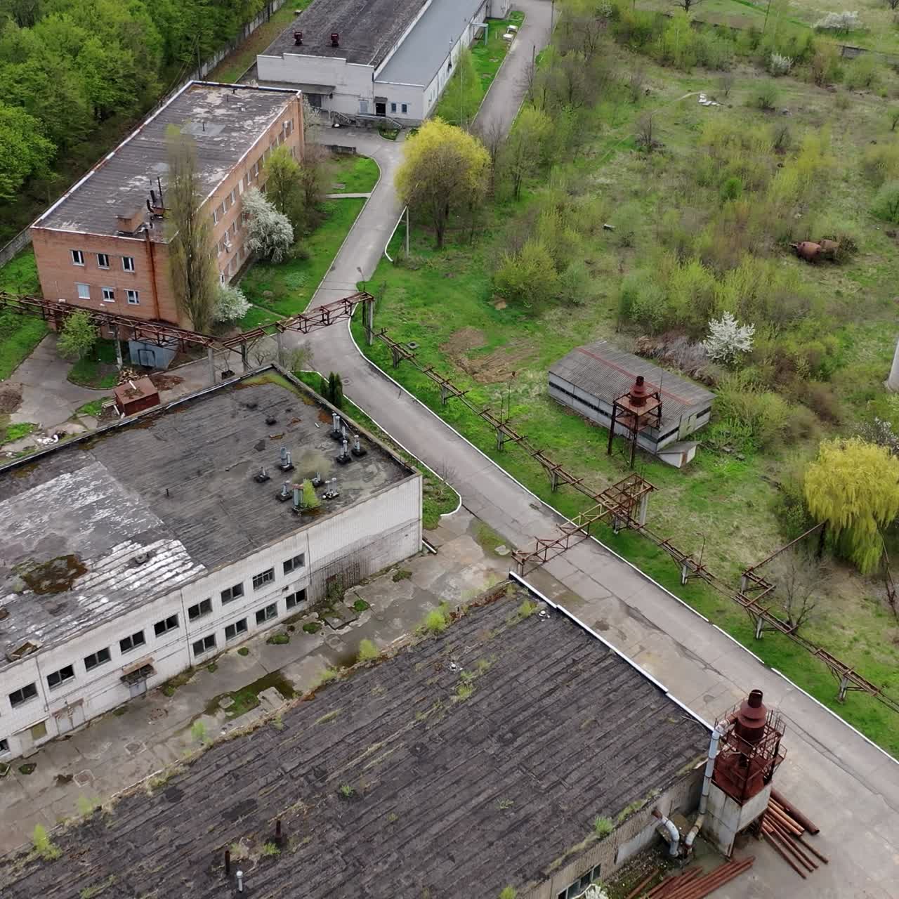 Apocalypsis aero view city. Aerial shot of crashed ruined factory in the city
