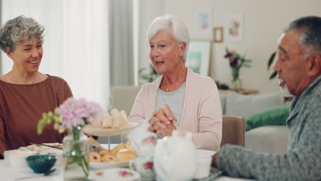 talking, tea and senior friends at a table