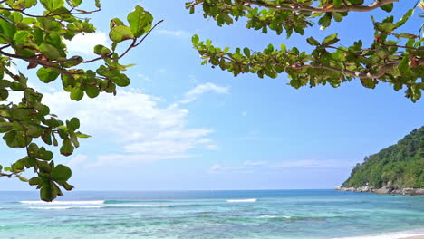 Tilt-down-from-the-sky-to-a-white-sandy-tropical-beach