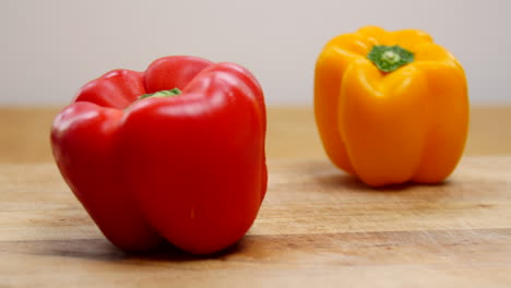 rack focus of red and yellow bell peppers