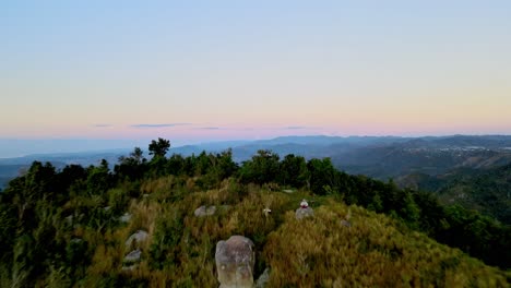 drone aerial shot in mountains during sunset