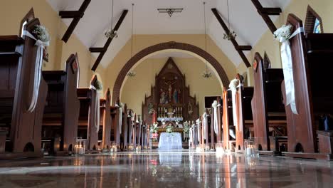 a small, atmospheric church beautifully decorated for wedding ceremonies