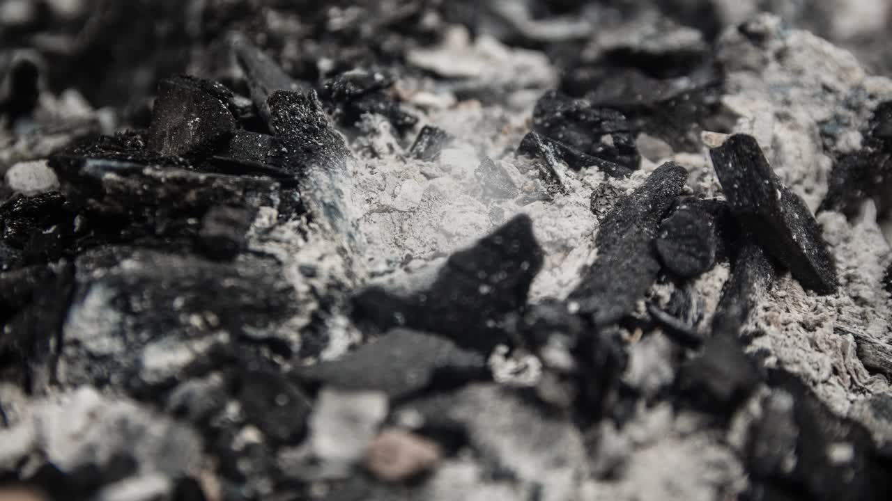 Cinemagraph of smoke emitted from burnt charcoal and ash