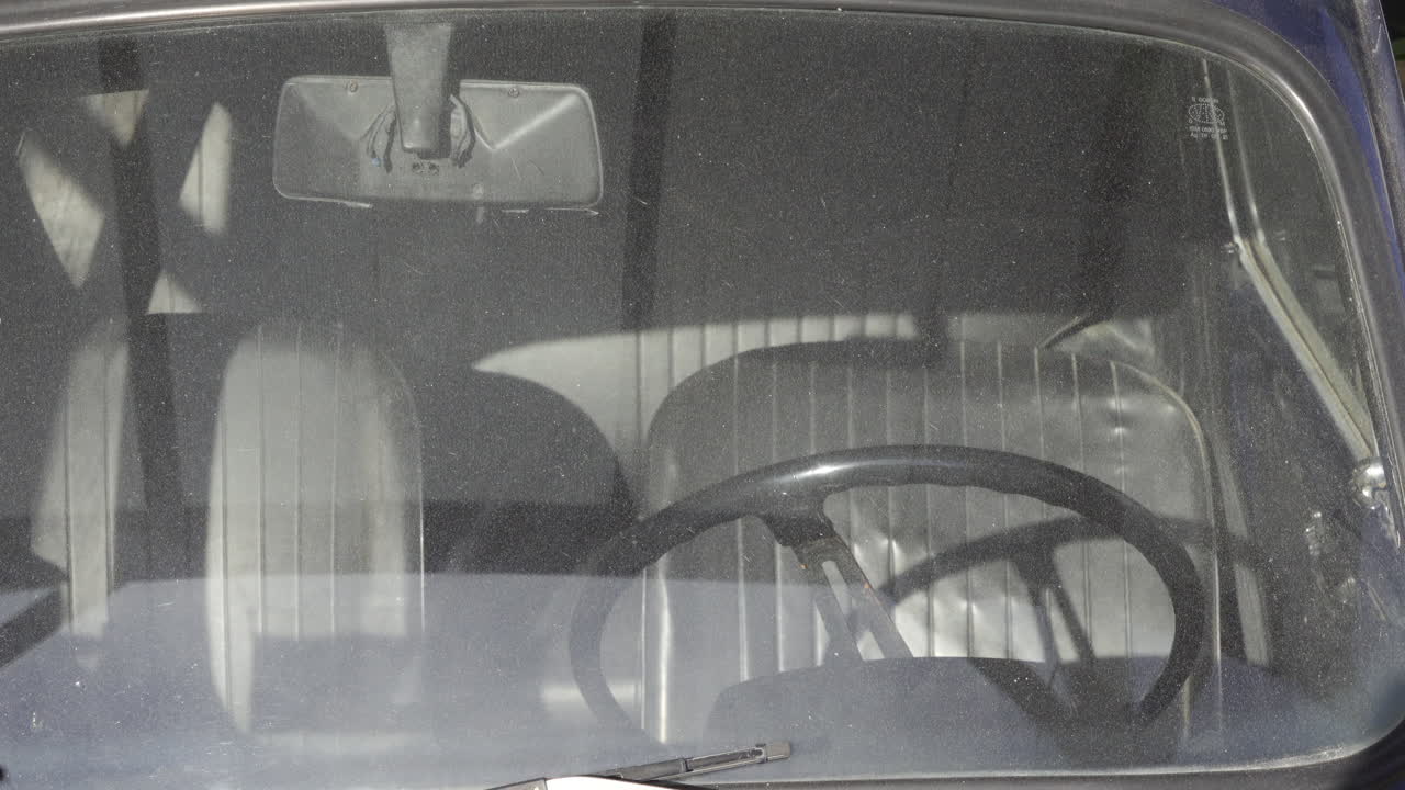 Antibes, France - May 9, 2025: View of the inside of an old car from the windshield