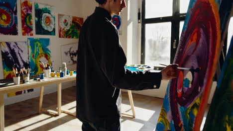 artist painting in a studio