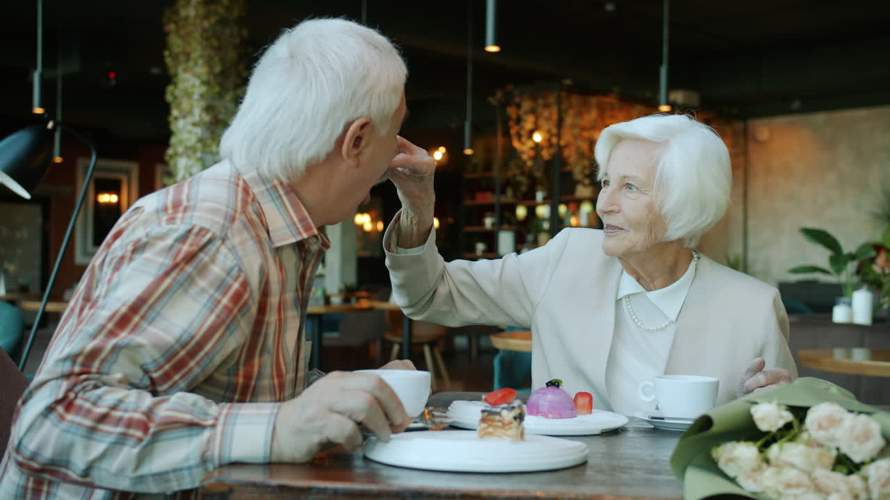 Elderly Couple Enjoying Dessert and Conversation
