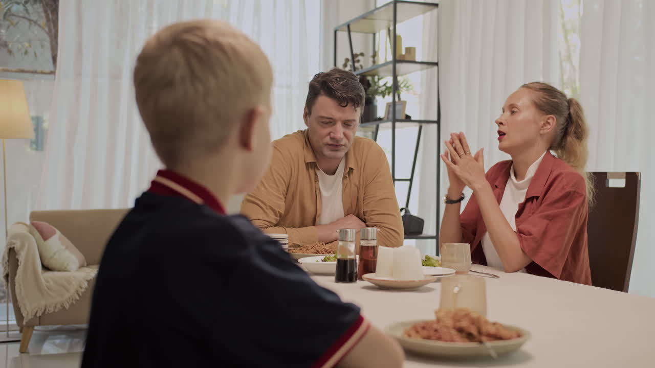 Teenager Suffering from Quarrel between Parents during Family Dinner