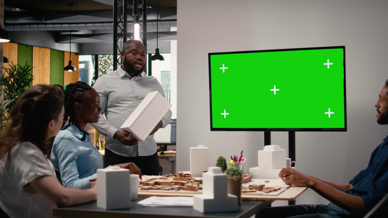 Diverse developers staff review zoning regulations next to copy space