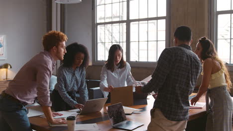 young creatives brainstorming ideas together at work