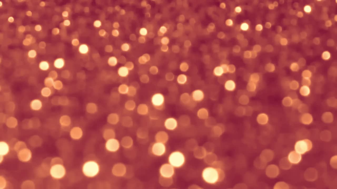 Riassunto Luci Bokeh rosse e dorate sullo sfondo
