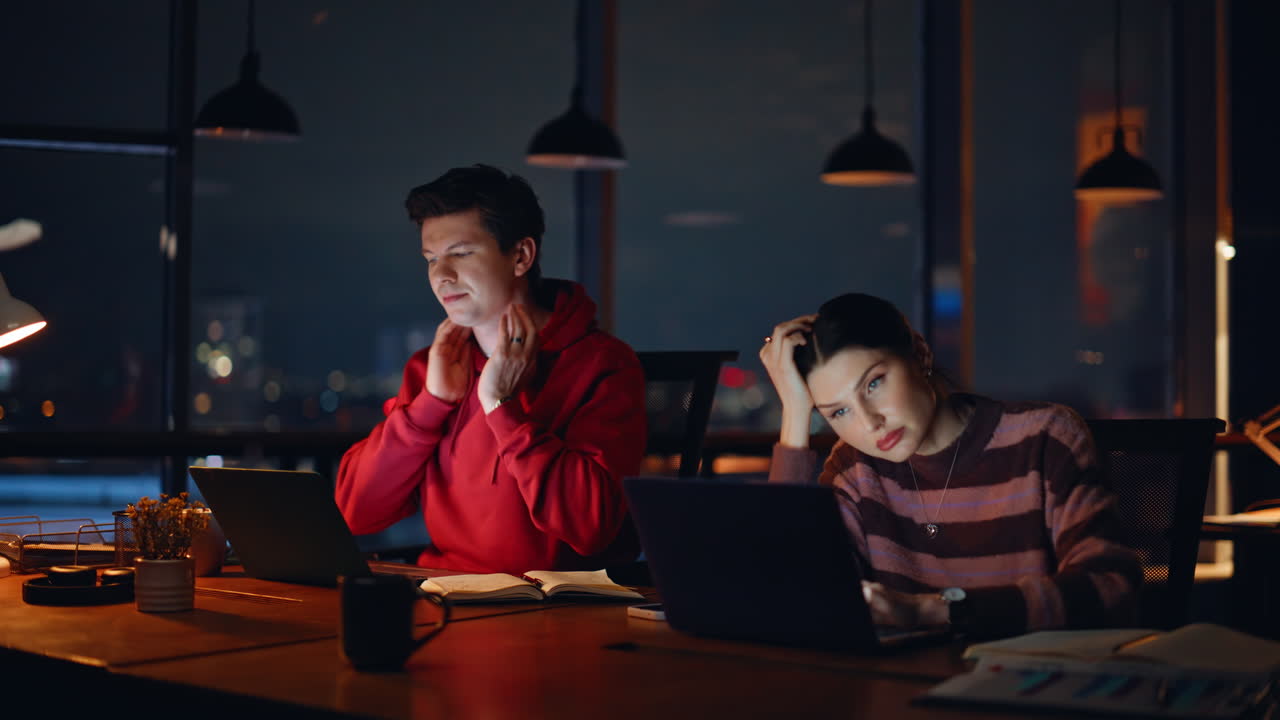 People Working Late at Night in Office