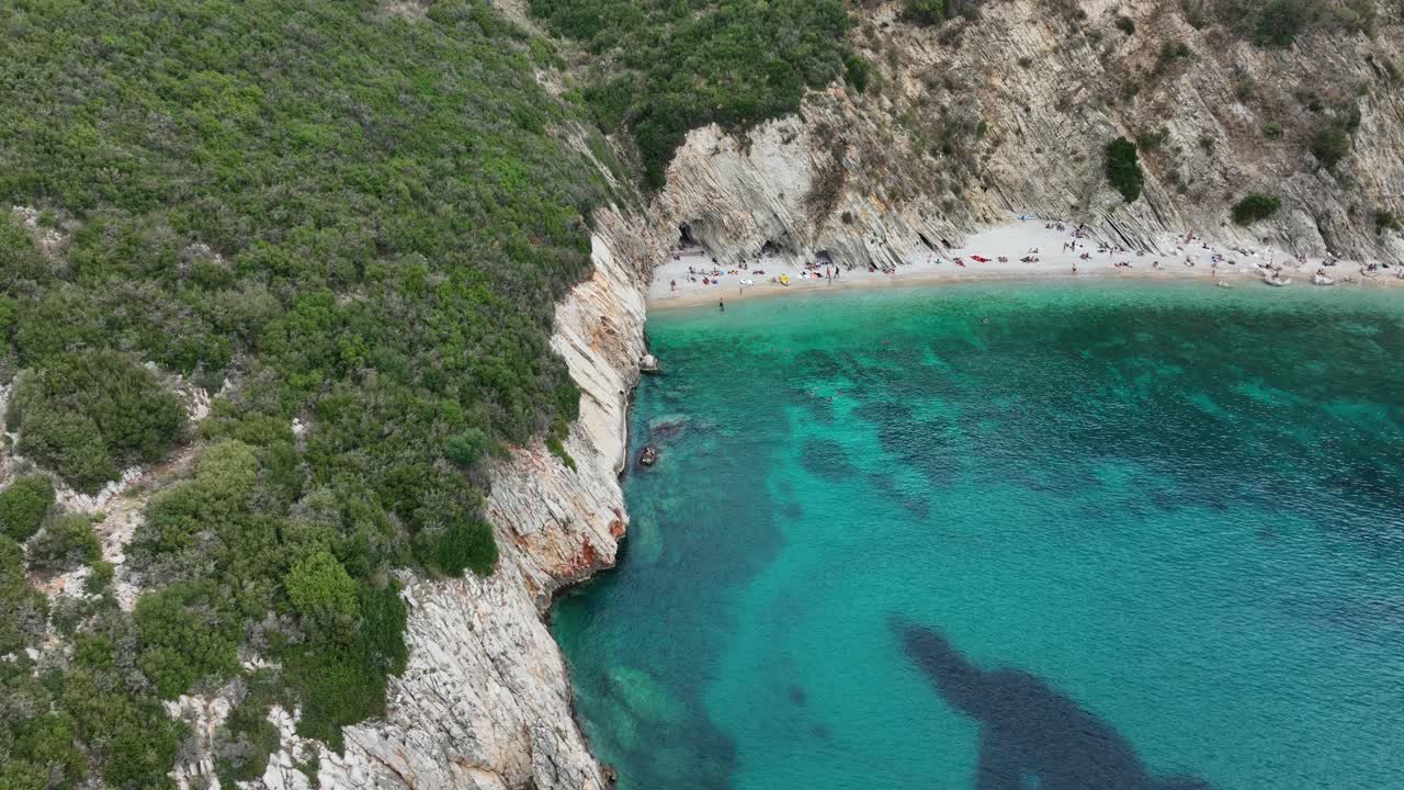 Gjipe beach in albania, showcasing the clear turquoise waters and lush green surroundings, aerial view