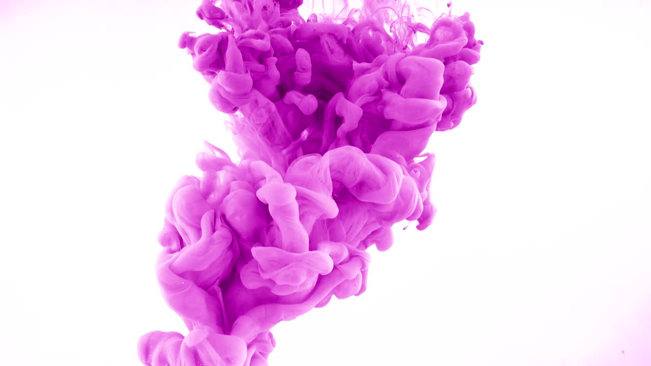 Pink ink dropped in water on white background