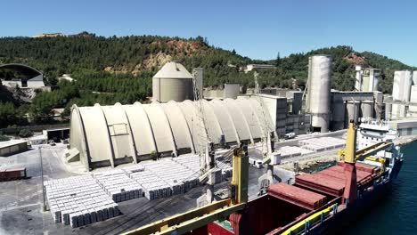 large cement factory near sea aerial view