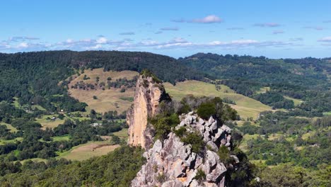 panoramic view of nimbin rocks with lush greenery and clear skies, showcasing natural beauty and geological formations