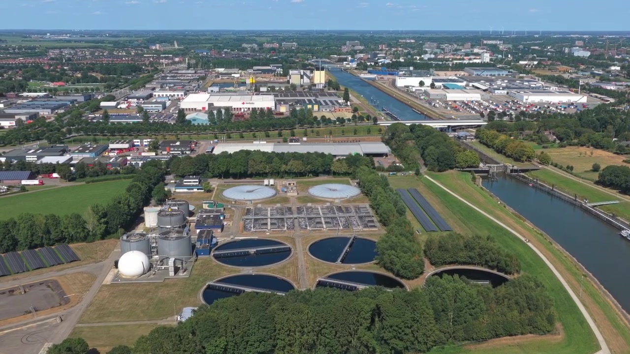 Aerial View of a Wastewater Treatment Plant Near a Canal
