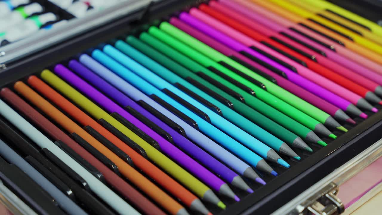 Detailed closeup of neatly organized colorful pencils in an art kit. Perfect for creativity, education, school, and design projects