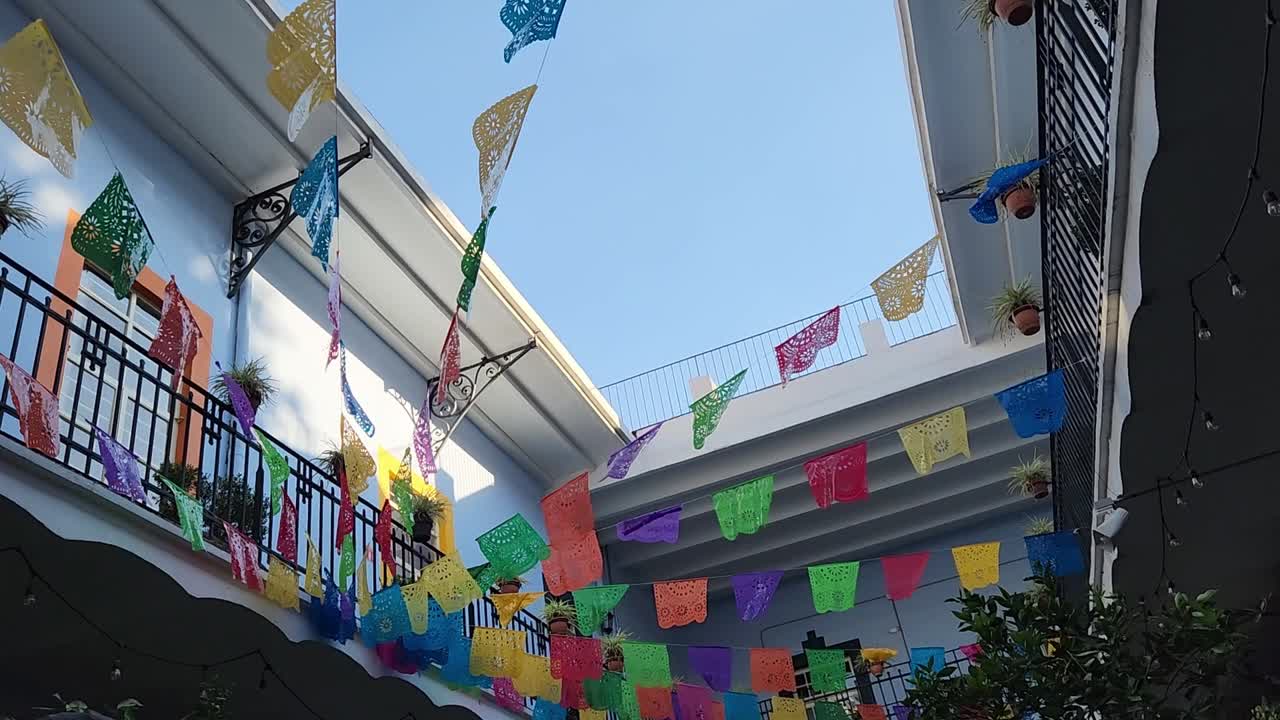 papel picado banners flapping in the wind in Mexico City