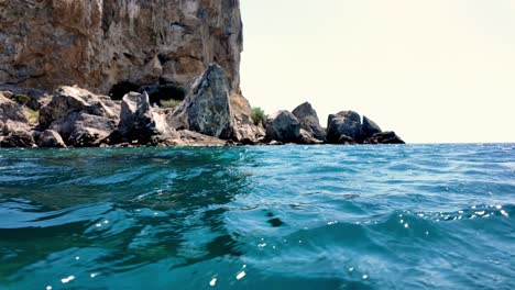 A-view-of-the-Black-Sea-from-a-boat,-with-rocky-cliffs-and-blue-water