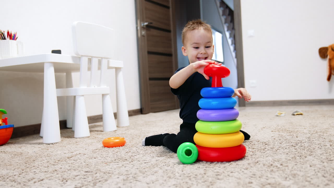 Colorful toy playing on the floor. Childhood educational activity with toys.